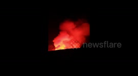 Plumes of smoke glow red as Hawaii's Kilauea volcano erupts