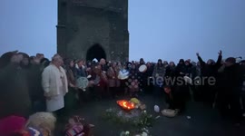 Crowds Gather at Glastonbury Tor for Winter Solstice Sunrise Celebrations