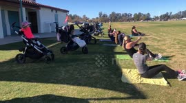 Moms toddlers and babies working out together during Covid social distancing at the park
