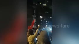 Chinese residents sing together to encourage quarantined neighbours