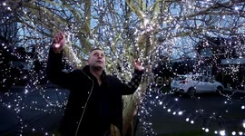 Homeowner creates stunning Christmas spectacle after hanging 50,000 lights on magnolia tree in his front garden