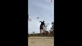 US man nails impressive basketball trick shots while balancing on slackline
