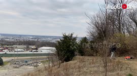 Incredible 100 yard blind backhand over a tree into a bucket