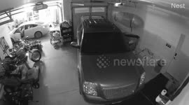 Husband scares wife by jumping out of hiding at her in garage