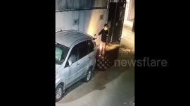 Cctv-pressed car rearview mirror thief. West Jakarta. Indonesia