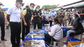 Thai police check seafood market following explosion of Covid-19 cases