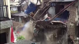 Surging river causes houses to collapse in Indonesia