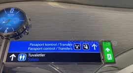 Two international travelers in Istanbul airport walking in hazmat suits
