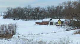 Ice and snow move in on a frozen Lake Superior in Ashland