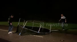UK storm-chasers find trampoline in middle of road during Storm Bella in cornwall