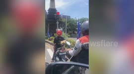 Remarkable rooster rides pillion on motorbike in Indonesia