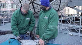 Workers install crystal triangles on iconic Times Square New Year’s Eve Ball ahead of virtual celebration