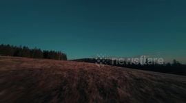 Mountain surfing at a sunset