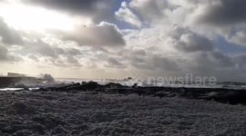 Storm Bella freeze brings sea foam to France and snow to the UK