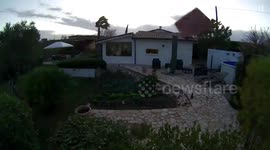 Security camera captures high wind blowing off roof in Italy