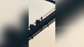 Tourists forced to walk down track after roller coaster gets stuck at Chinese theme park