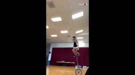 Talented Guy Multitasking On 8 Foot High Unicycle