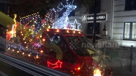 Shining lights of Christmas sleigh in Knightsbridge from a bus window