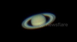 Astrophotographer films Saturn though a telescope in Israeli desert