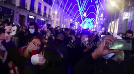 Crowds gather in Madrid to usher in the new year with impressive firework display