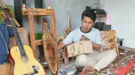 Indonesian woodworker uses pyrography to create unique artwork