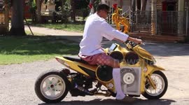 Buddhist monk pimps his motorcycle with speakers attached to the sides