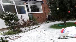 Snowman rises up from the snow