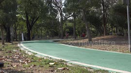 Adults and children cyclists getting some exercise in a park in Bangkok, on January 1st, 2021.