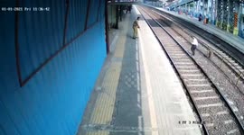 Indian police official rescued man who fell while crossing railway tracks in western India