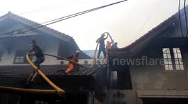 Fire Brigade Team Falling Out of Home Attic While Extinguishing Fire Fires in Central Jakarta, Indonesia