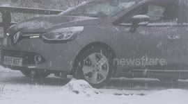 Cars stuck on hill as heavy snow hits Gloucestershire