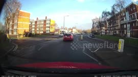 Pedestrian steps onto a zebra crossing in front of a unaware learner driver just avoiding being hit