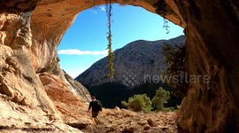 Hikers exploring a cavern in mountain top