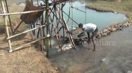 Indian farmer devises ingenious irrigation system using plastic bottles