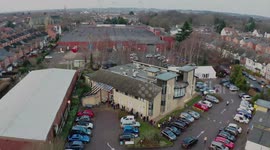 Drone footage captures queue of people waiting for COVID-19 vaccination