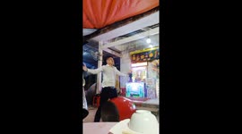 Vietnamese man lifts drum up with eyelids