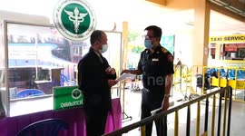 Passengers screened for COVID-19 at bus station in Thailand