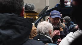 Assange supporters pop champagne outside London Old Bailey court after extradition verdict