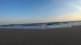Waves at sunset in the sand on the shore of Bahia Kino beach, Sonora, Mexico. Summer