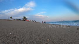 Waves at sunset in the sand on the shore of Bahia Kino beach, Sonora, Mexico. Summer