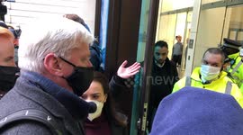 Julian Assange’s fiancé and former diplomat Craig Murray seen waiting outside court ahead of bail hearing