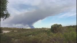 Smoke cloud rises into air as bushfire continues to burn near Perth, Australia