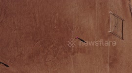 Aerial view of a cemetery, soccer field and dirt baseball fields in the community of Paredón Colorado or also called Paredón Viejo is a ranchería in the municipality of Benito Juárez, located in the southern Mexican state of Sonora, on the coast with the