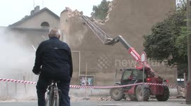 PREROV, CZECH REPUBLIC, OCTOBER 4, 2010: Demolition of  preserved historical building with brickwork wall red built in 1873, Austria-Hungary. Nonsense human behavior. Special demolition excavator Manitou Maniscopic