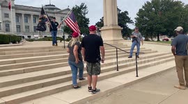 Richard Barnett who posed at Nancy Pelosi's desk seen carrying assault rifle outside Arkansas State Capitol