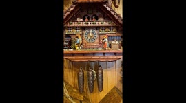 Small black forest clock in cuckoo clock shop