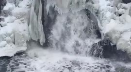 Watch incredible video as waterfall freezes, leaving a cascade of ice and foam in Sioux Falls, South Dakota