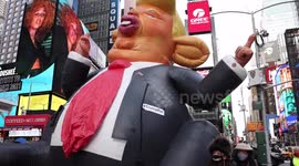 Giant inflatable Trump rat carried through New York's Times Square