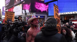 Naked Cowboy taunted and surrounded while arguing with anti-Trump protest leader