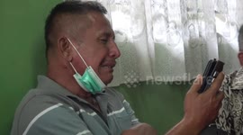 Neighbours comfort distraught parents of man missing in Indonesian plane crash